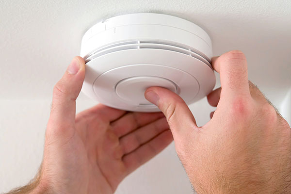 Smoke Alarm Being Installed in Gold Coast Home